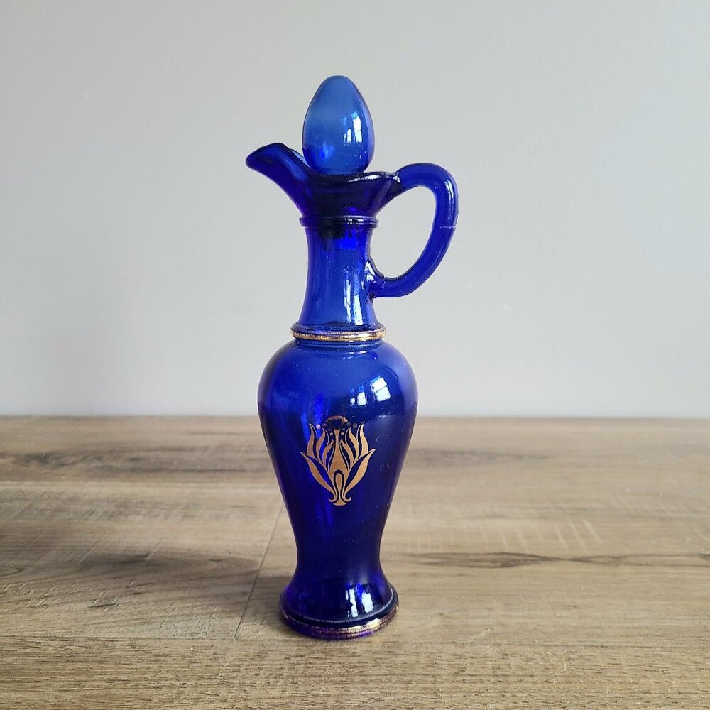 Vintage Avon cobalt blue bottle. vase/ decanter with lid.